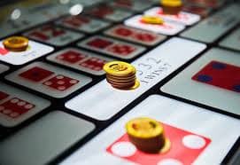 Layar permainan Bonanza Gold di rawit303 menampilkan grid 6x5 dengan simbol-simbol berwarna dan fitur cascade